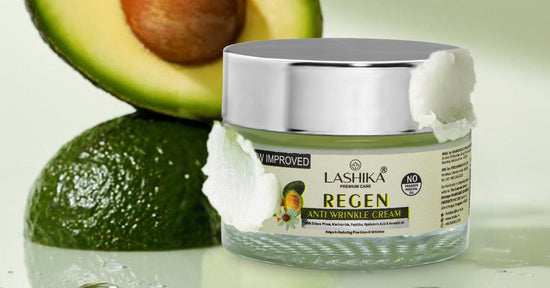 Lashika Regen Anti-Wrinkle Cream jar showcased against a soft green background, with a halved avocado behind it to highlight its key ingredient. The label mentions the cream contains Niacinamide, Peptides, Hyaluronic Acid, and Avocado Oil.