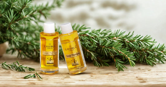 Lashika Scalp Therapy Hair Oil and Hair Serum bottles placed on a wooden surface with fresh rosemary in the background, highlighting natural ingredients like argan oil, onion oil, tea tree oil, and macadamia oil for scalp nourishment and hair health.