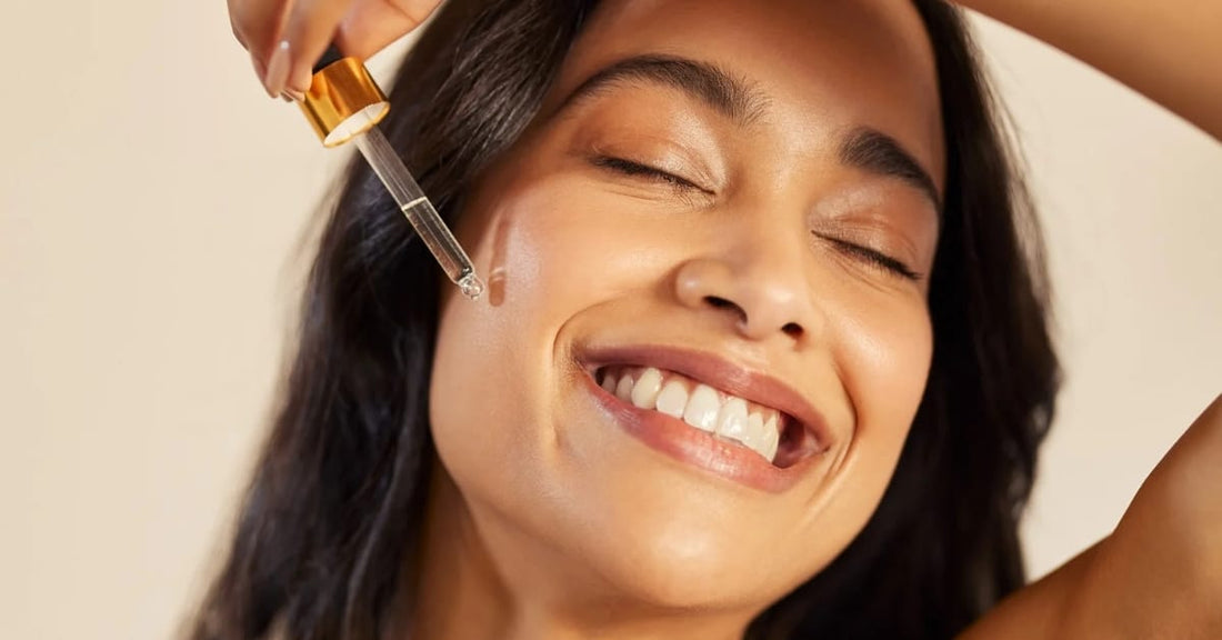 A Woman using a glass dropper and applying serum on her face, reflecting purity and skincare.