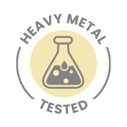A yellow circle with a grey flask containing bubbles. The words "HEAVY METAL TESTED" surround the circle. Lashika's products have been tested for heavy metals and found to be free of them.