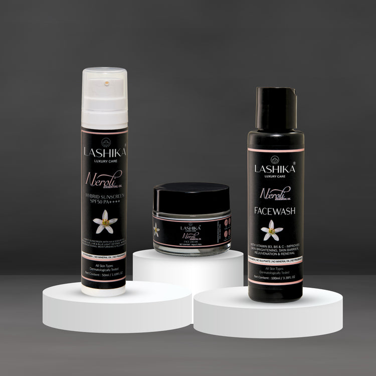 A trio of Lashika Neroli skincare products, including a Hybrid Sunscreen with SPF 50 PA++++, a gentle Face Wash, and a nourishing Face Cream, all designed to protect and enhance the skin&
