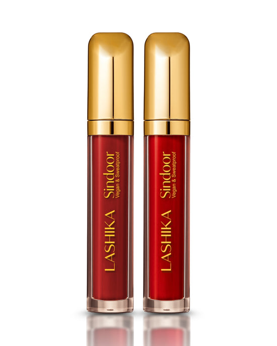 Two bottles with gold caps labeled &